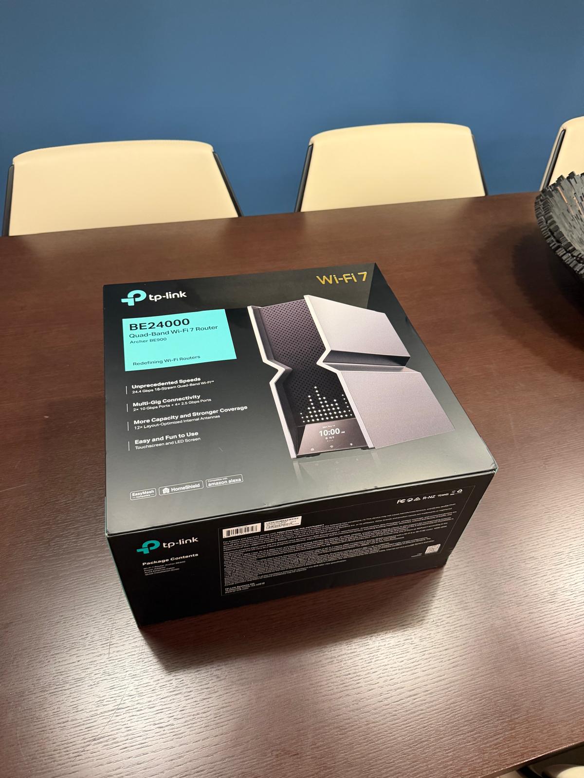 TP-Link BE24000 Wi-Fi 7 router box highlighting quad-band speeds and dual 10-gig ports