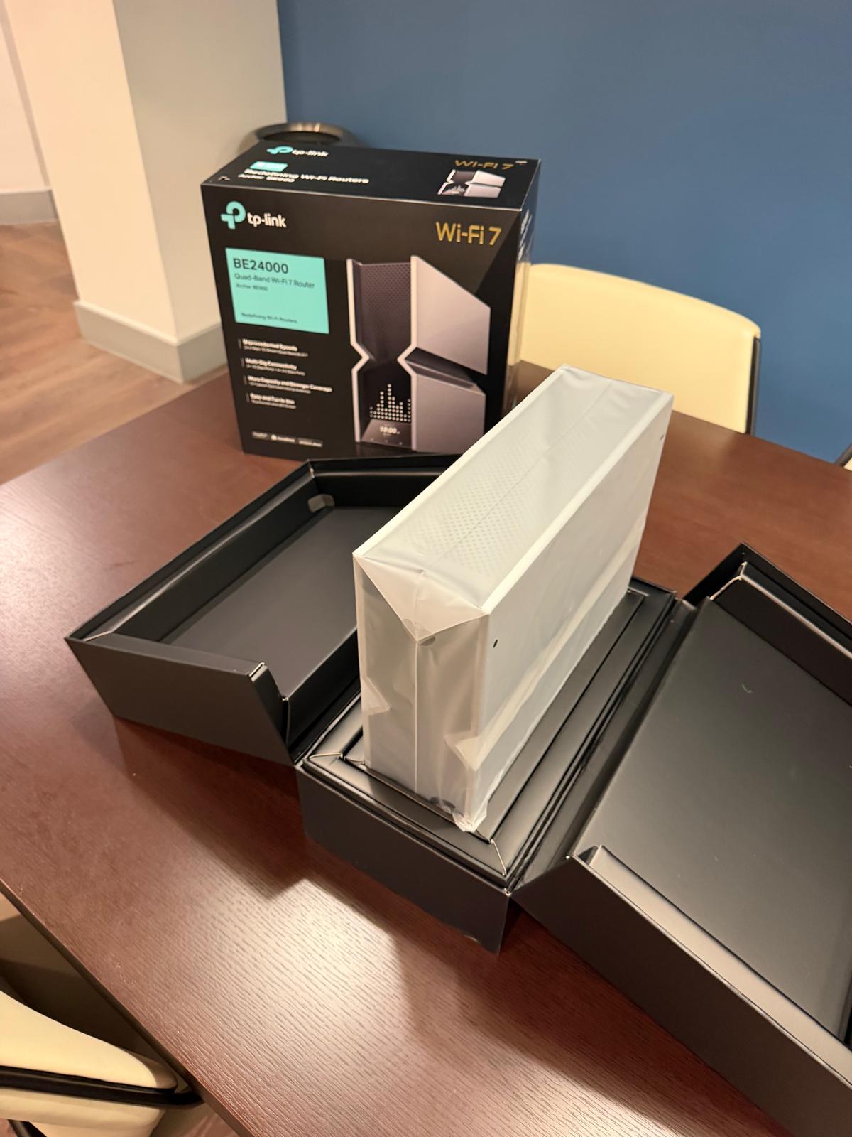 A personal WiFi 7 router (TP-Link BE24000) being unboxed at The Anderson